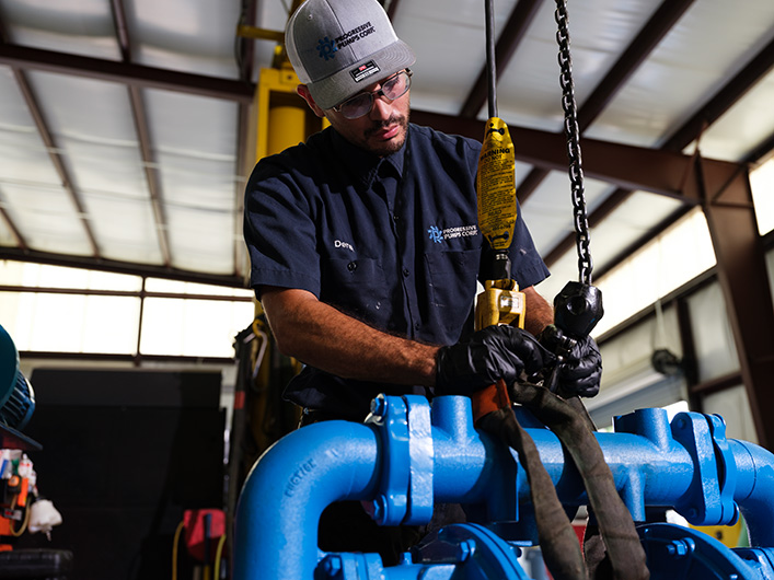 Photo of an employee handling a pump